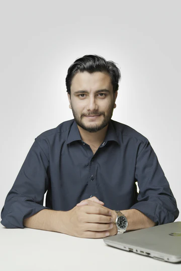 Hasnat Ali at his desk